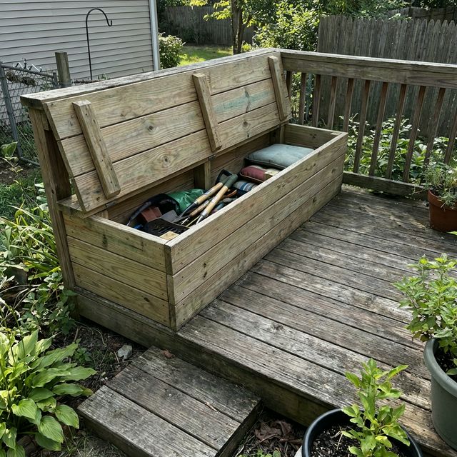 DIY built-in storage bench on a wooden deck