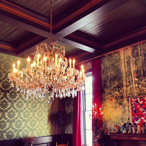 Painted ceiling beams with chandelier