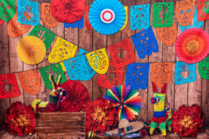 Mexican fiesta table with bold colors and papel picado banners